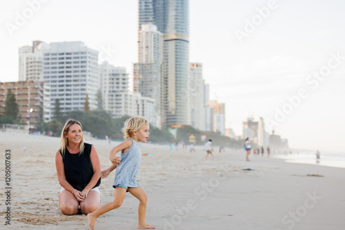 Mother and son playing in the sand on Main Beach at Surfers Paradise on the Gold Coast