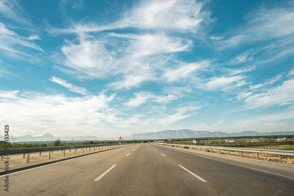 Three lane highway going forward on a sunny day Three lane highway going forward on a sunny day