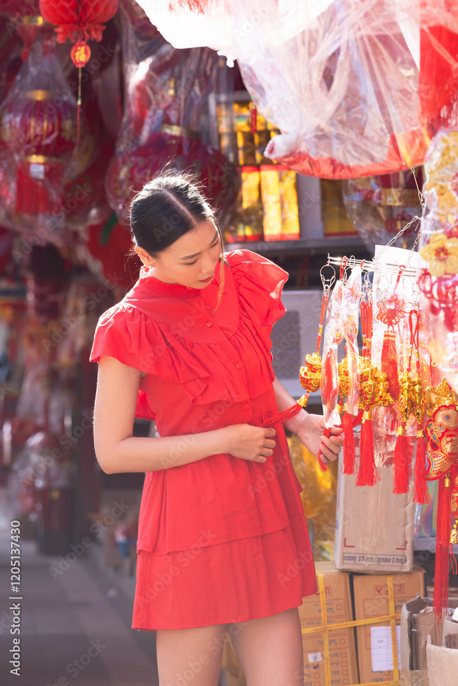© Kalyakan - Asian Chinese woman choosing and shoping home decorative ornaments for celebrating Chinese New Year festival at Chinatown street market, Happy Chinese New Year. © Kalyakan - Asian Chinese woman choosing and shoping home decorative ornaments for celebrating Chinese New Year festival at Chinatown street market, Happy Chinese New Year.