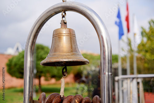 Photography Close-Up of an Antique Brass Bell in Outdoor Settings