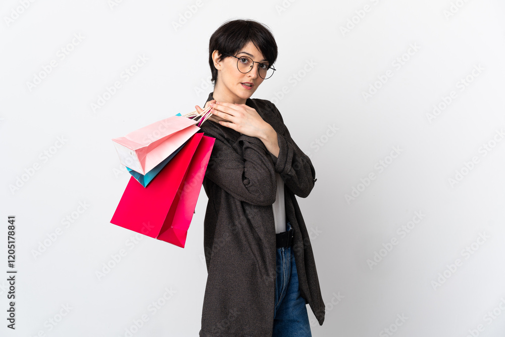 Woman with short hair isolated on white background holding shopping bags Woman with short hair isolated on white background holding shopping bags