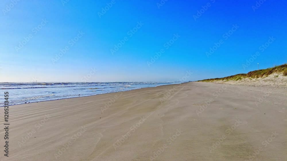 Ocean waves lapping on the secluded beach along the Texas Gulf Coast, on a sunny morning. Ocean waves lapping on the secluded beach along the Texas Gulf Coast, on a sunny morning.