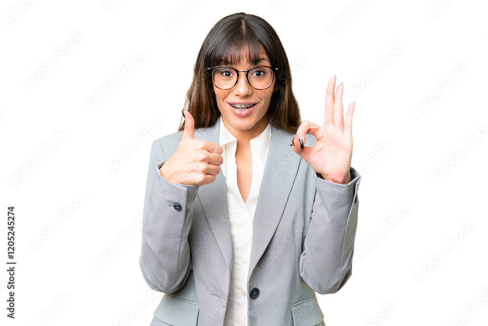 Young caucasian woman over isolated chroma key background showing ok sign and thumb up gesture Young caucasian woman over isolated chroma key background showing ok sign and thumb up gesture