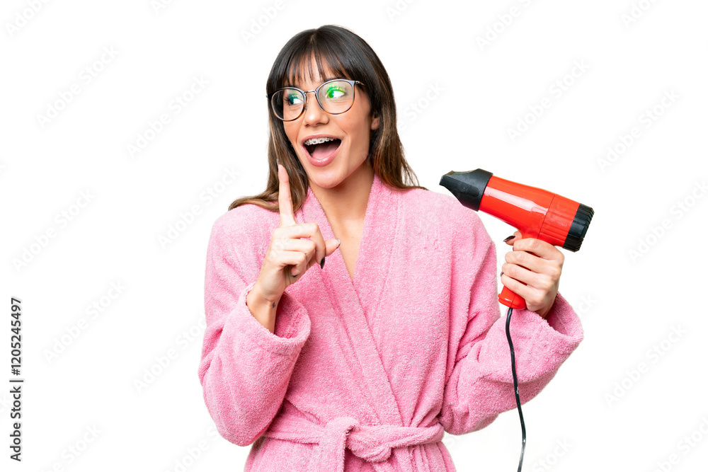 Young caucasian man holding a hairdryer over isolated chroma key background intending to realizes the solution while lifting a finger up