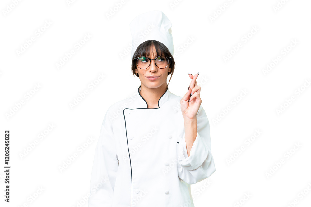 Young caucasian chef woman over isolated chroma key background with fingers crossing and wishing the best Young caucasian chef woman over isolated chroma key background with fingers crossing and wishing the best