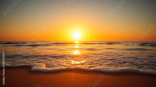 The golden light of the setting sun paints the sky with hues of orange and pink as it dips below the horizon, casting a mesmerizing reflection on the calm ocean waves that gently caress the sandy beac