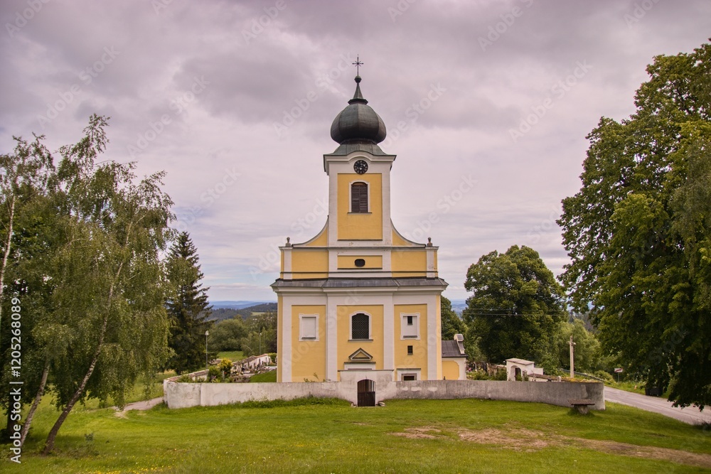 A front view of Church of Saint Adalbert in village Lsteni, Czech republic