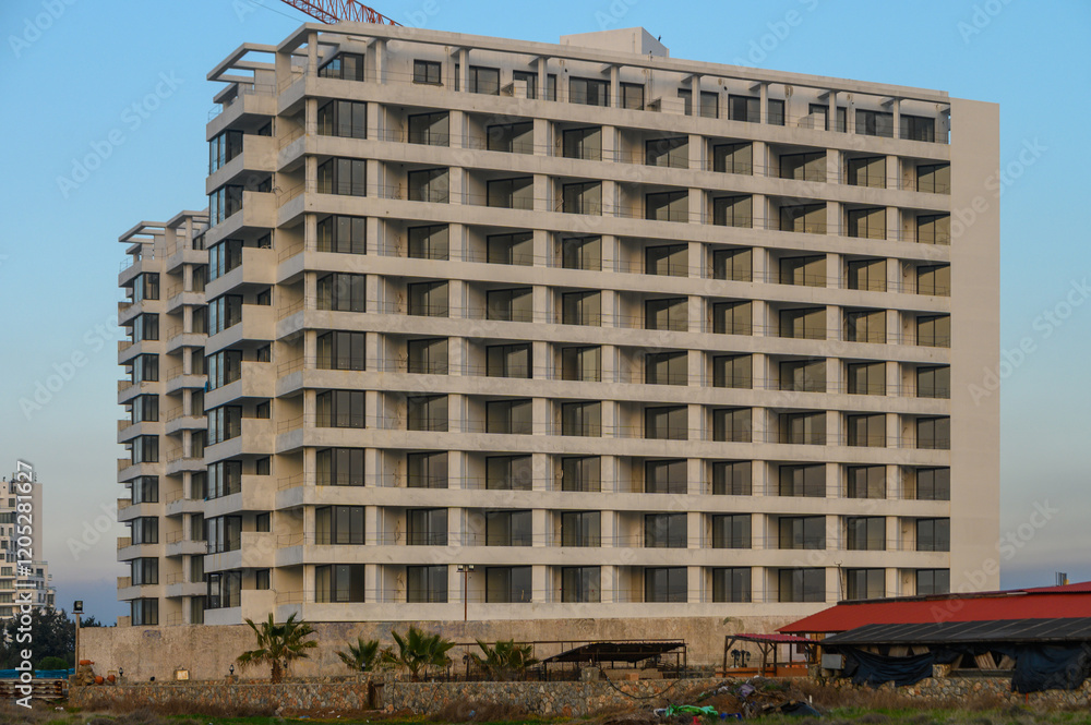 Fototapeta premium Modern architecture stands tall against a clear blue sky in a vibrant cityscape