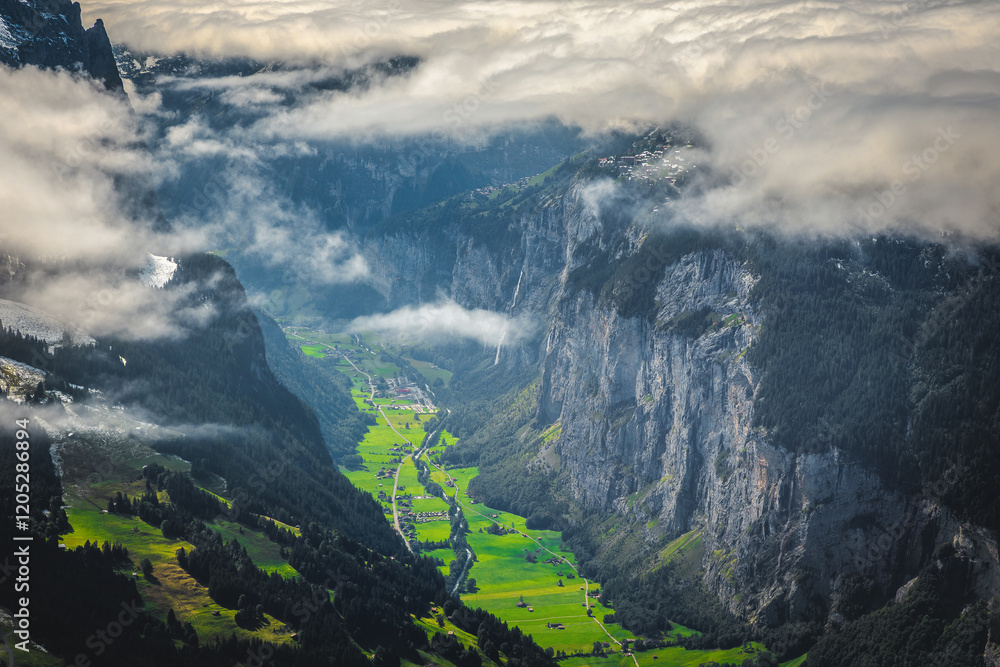 Green fields and stunning cliffs in Lauterbrunnen valley, Switzerland