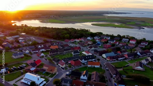 Aerial flyover of coastal town of Beaufort, South Carolina, USA at sunset.