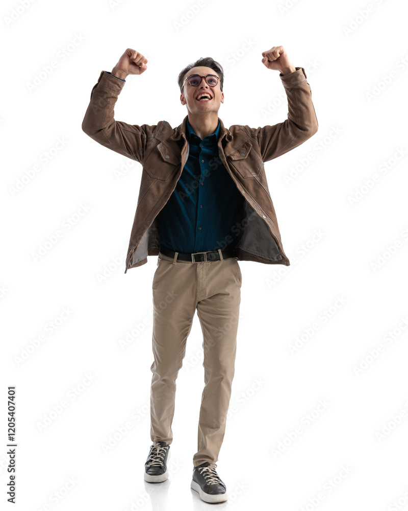 excited smart casual man walking forward and celebrating excited smart casual man walking forward and celebrating
