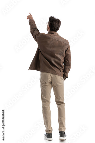back view of smart casual man pointing in the distance