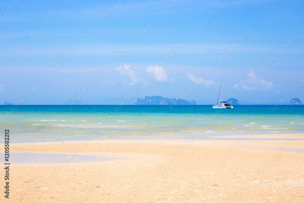 Seascape. Sandy beach with boat in azure sea water and islands in the sea on the horizon in Krabi province Thailand Seascape. Sandy beach with boat in azure sea water and islands in the sea on the horizon in Krabi province Thailand