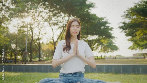 Beautiful Attractive Asian woman practice yoga in the sunny park Woman warming up for a morning workout outdoors. Fitness, calm and breathing of Asian woman outdoor in nature, freedom and mindfulness Free Download Beautiful Attractive Asian woman practice yoga in the sunny park Woman warming up for a morning workout outdoors. Fitness, calm and breathing of Asian woman outdoor in nature, freedom and mindfulness - GFXLoad