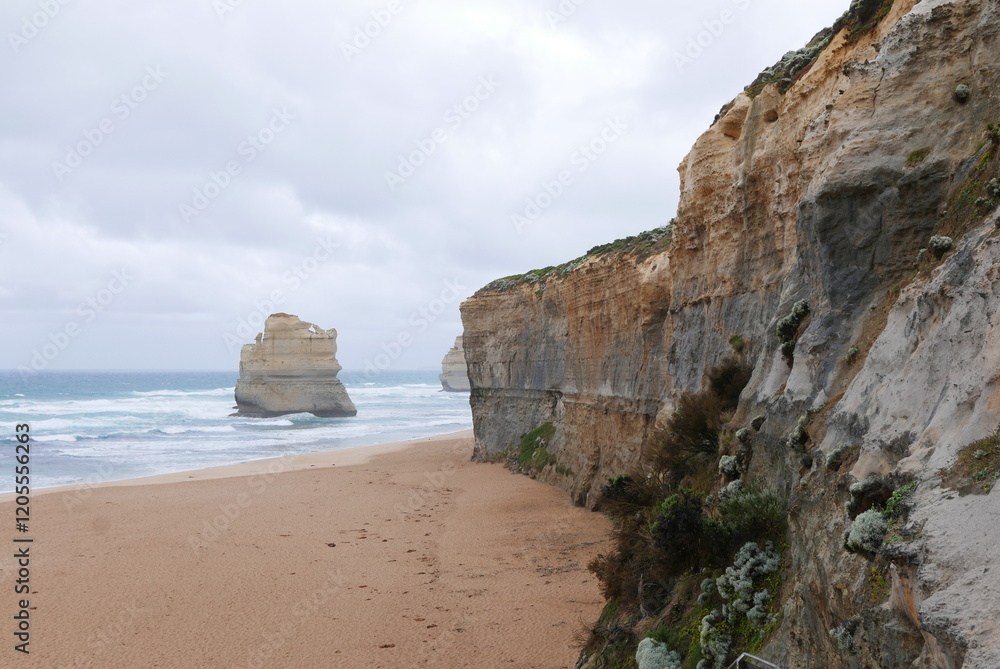 Fototapeta premium Gibson Steps, on the Great Ocean Road, offers stunning coastal views with towering cliffs and beach access to admire two of the Twelve Apostles up close, perfect for photography and exploration.