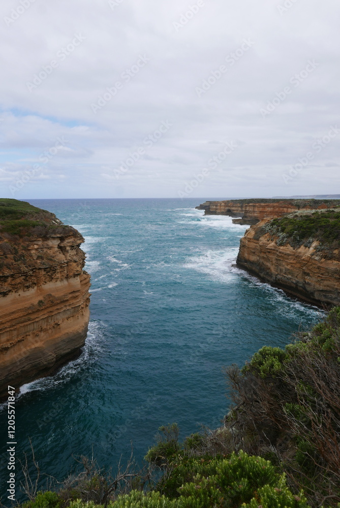 Loch Ard Gorge, situated along the Great Ocean Road in Victoria, is a stunning natural wonder featuring dramatic limestone cliffs, clear blue waters, and a historical shipwreck site, with walking trai Loch Ard Gorge, situated along the Great Ocean Road in Victoria, is a stunning natural wonder featuring dramatic limestone cliffs, clear blue waters, and a historical shipwreck site, with walking trai