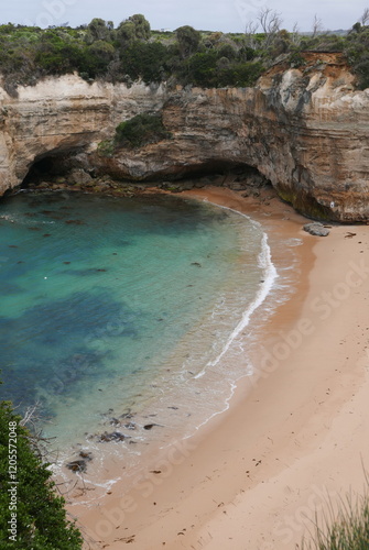 Loch Ard Gorge, situated along the Great Ocean Road in Victoria, is a stunning natural wonder featuring dramatic limestone cliffs, clear blue waters, and a historical shipwreck site, with walking trai photo