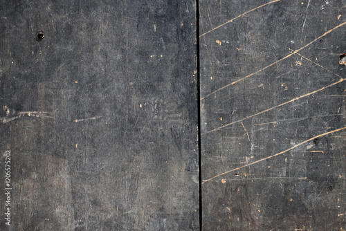 
Photograph of dirty, worn and scratched black wood background in grunge style.