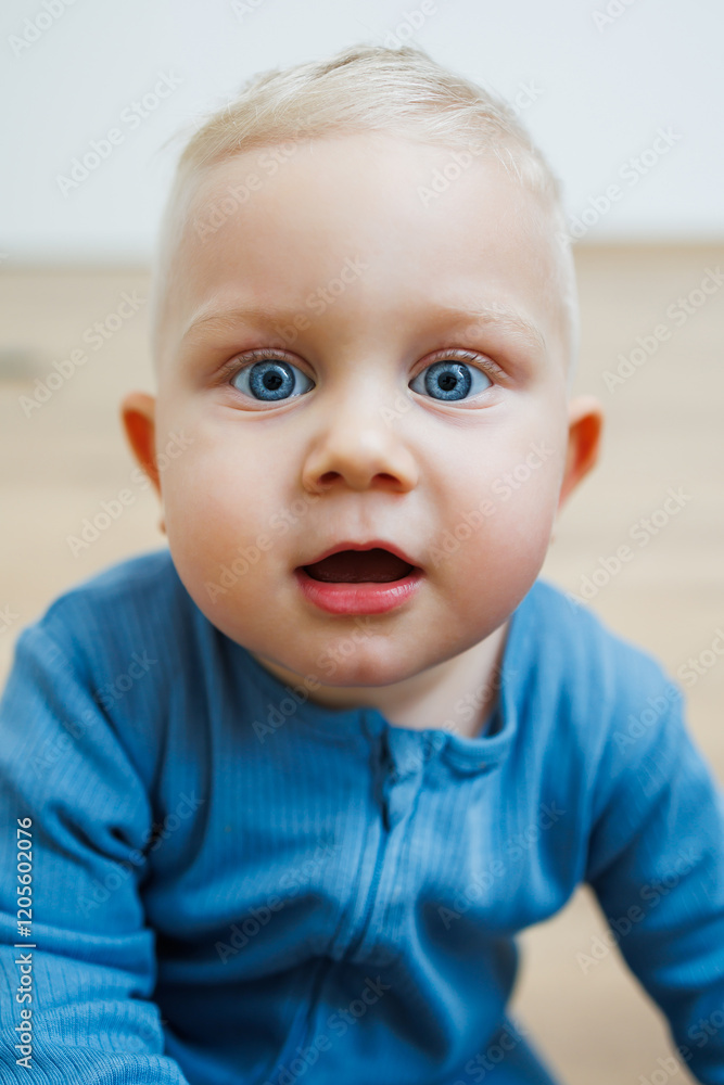 Little one-year-old boy with different emotions on his face close-up. Emotional baby. Cheerful boy. Blue-eyed toddler boy. Little one-year-old boy with different emotions on his face close-up. Emotional baby. Cheerful boy. Blue-eyed toddler boy.