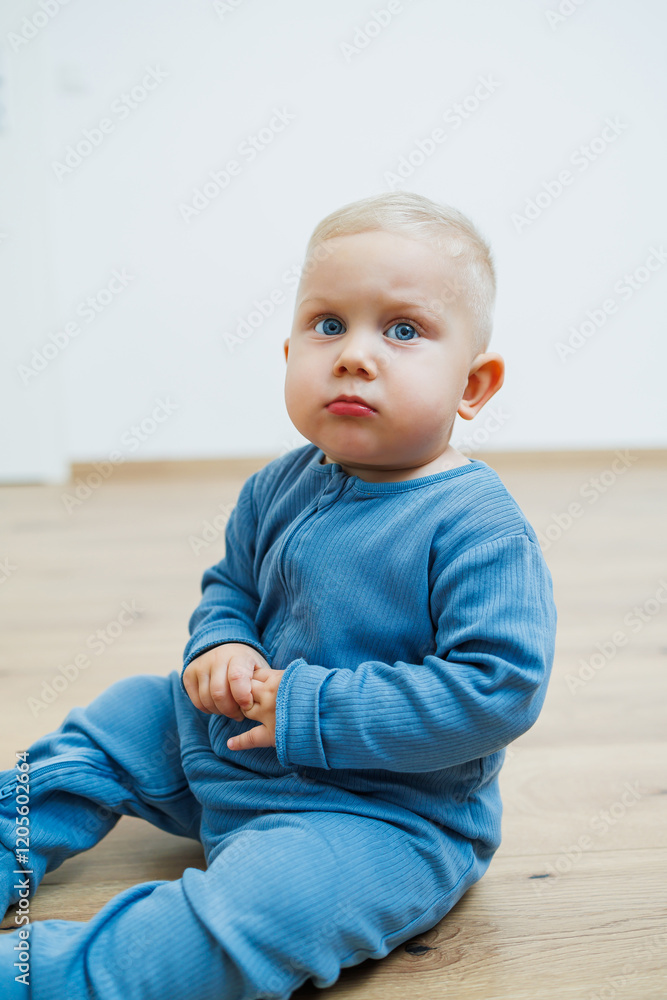 Little one-year-old boy with different emotions on his face close-up. Emotional baby. Cheerful boy. Blue-eyed toddler boy. Little one-year-old boy with different emotions on his face close-up. Emotional baby. Cheerful boy. Blue-eyed toddler boy.