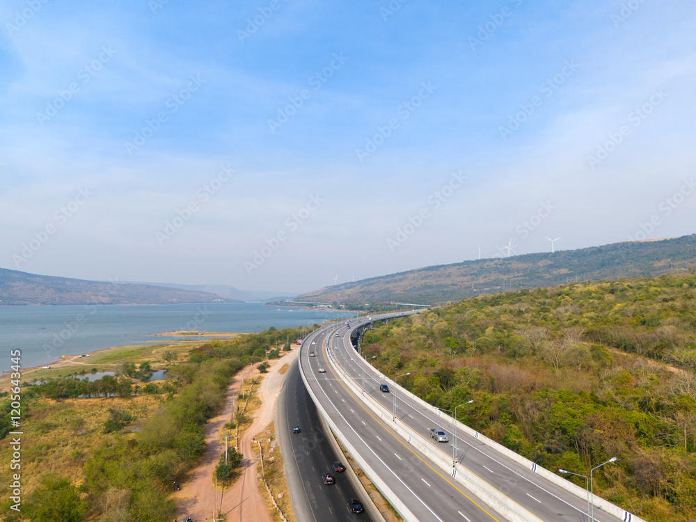 The M6 motorway Expressway Nakhon Ratchasima Province - Bang Pa-in. Lam Ta Khong River and Mountain. Drone shot of scenic landscape rural place traffic. Nakhon Ratchasima Thailand. Motorway Korat The M6 motorway Expressway Nakhon Ratchasima Province - Bang Pa-in. Lam Ta Khong River and Mountain. Drone shot of scenic landscape rural place traffic. Nakhon Ratchasima Thailand. Motorway Korat