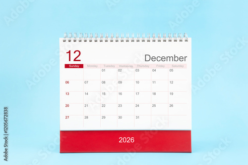 December 2026 Monthly desk calendar for 2026 year on blue color background, Front view. photo