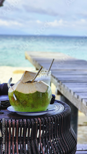Coconut juice by the beach during holiday in Thailand