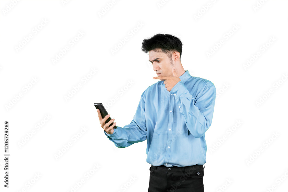 Businessman Analyzing Smartphone with Focused Expression Businessman Analyzing Smartphone with Focused Expression