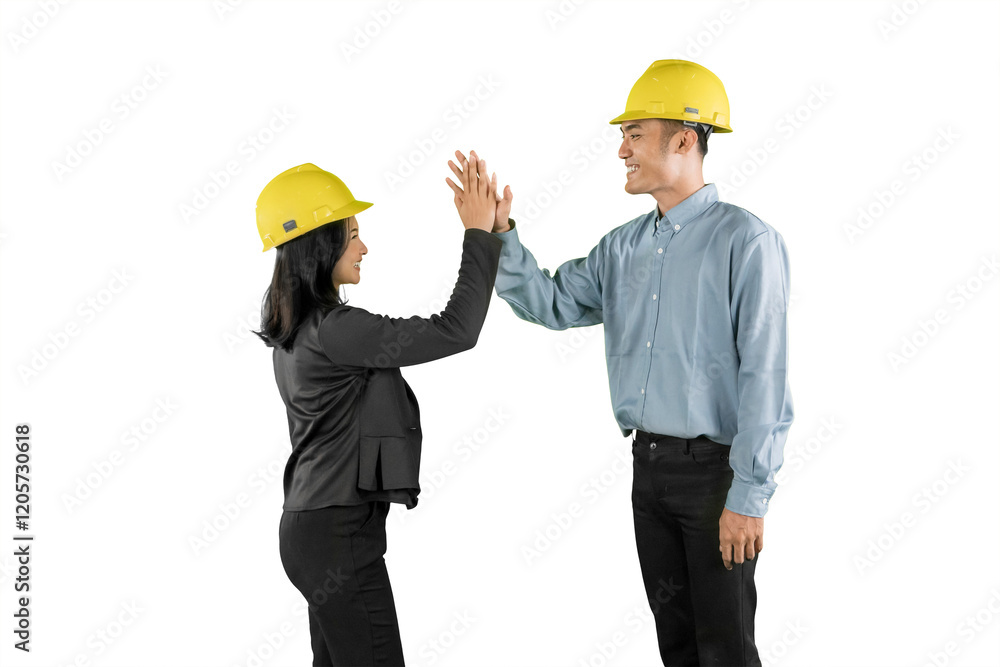 Construction Team High-Fiving for Successful Collaboration Construction Team High-Fiving for Successful Collaboration
