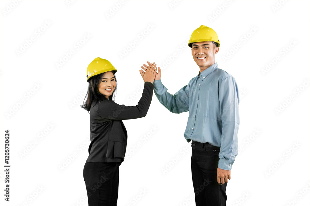 Smiling Construction Professionals High-Fiving in Celebration of Teamwork Smiling Construction Professionals High-Fiving in Celebration of Teamwork