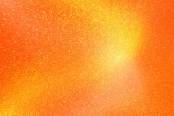 Orange glitter paper texture background with space. glitter star effect just like space. night sky universe rusty texture rough grain.