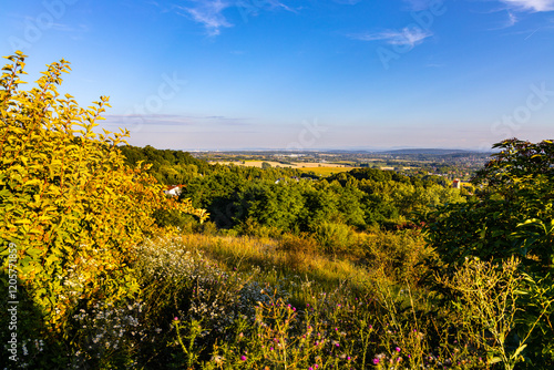 Fototapeta Naklejka Na Ścianę i Meble -  Panoramic view of Cracow Valleys landscape park of Cracow-Czestochowa Jurassic natural reserve seen from Bolechowice village with Beskidy mountains in background in Lesser Poland