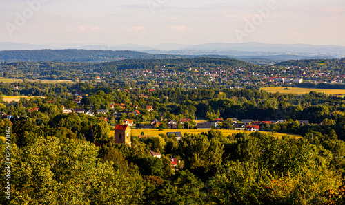Fototapeta Naklejka Na Ścianę i Meble -  Panoramic view of Cracow Valleys landscape park of Cracow-Czestochowa Jurassic natural reserve seen from Bolechowice village with Beskidy mountains in background in Lesser Poland