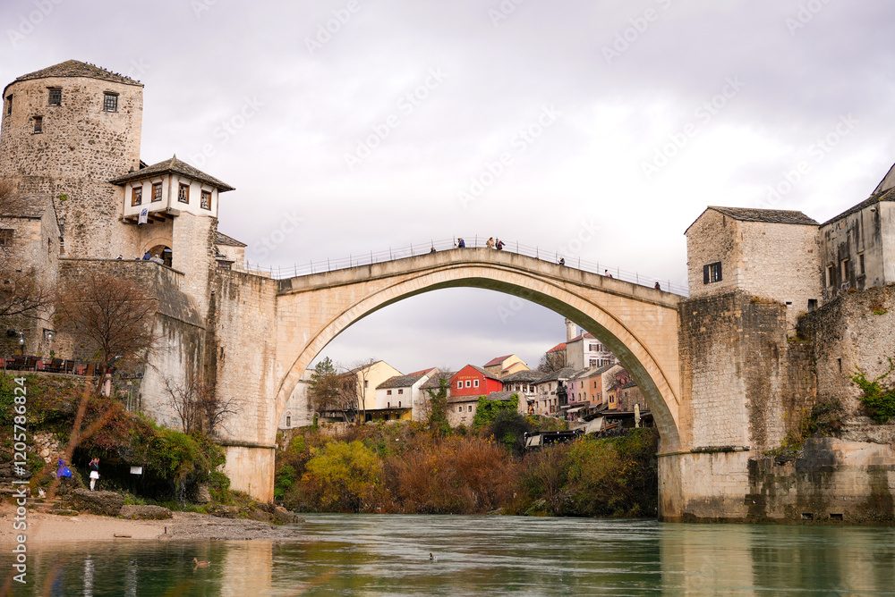 A beautiful view of the old bridge across the Neretva River in Mostar, Bosnia and Herzegovina A beautiful view of the old bridge across the Neretva River in Mostar, Bosnia and Herzegovina