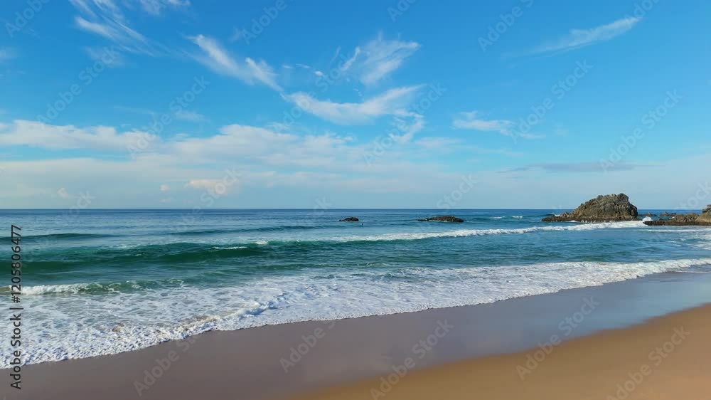 Adraga Beach and Waves on Sunny Day. Atlantic Ocean, Portugal. Aerial View. Moving Forward at Low Level Adraga Beach and Waves on Sunny Day. Atlantic Ocean, Portugal. Aerial View. Moving Forward at Low Level