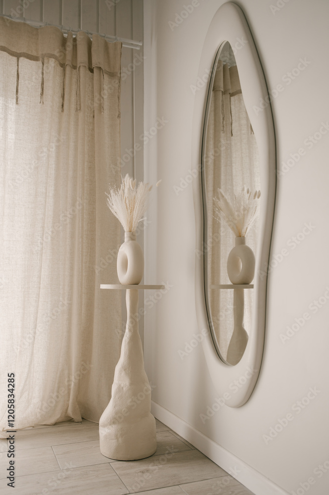 Beautiful light beige interior with curved mirror in wooden frame in japandi and wawabi sabi style, cozy home concept