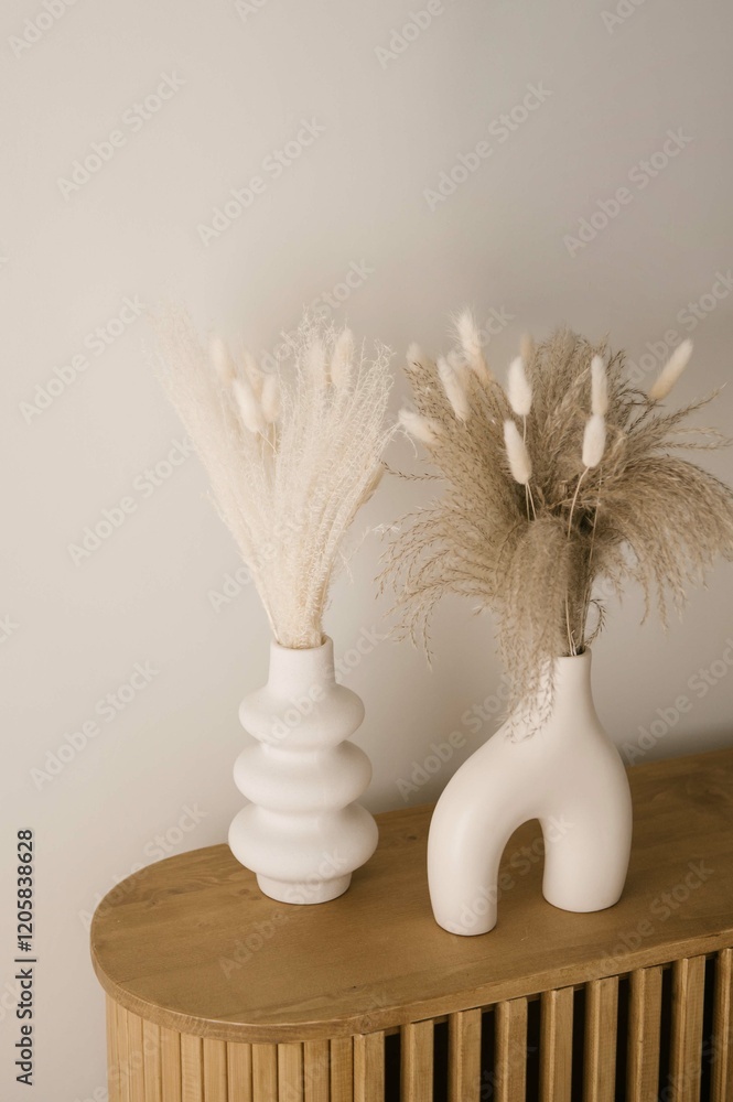 vase with dried flowers, details of stylish interior of cozy house in Japandi style