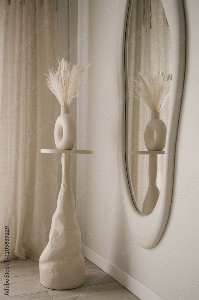 Beautiful light beige interior with curved mirror in wooden frame in japandi and wawabi sabi style, cozy home concept