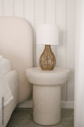 Obraz na płótnie Beautiful light beige interior with soft white bed decorated with pillows in japandi and wawabi sabi style, cozy home concept w salonie