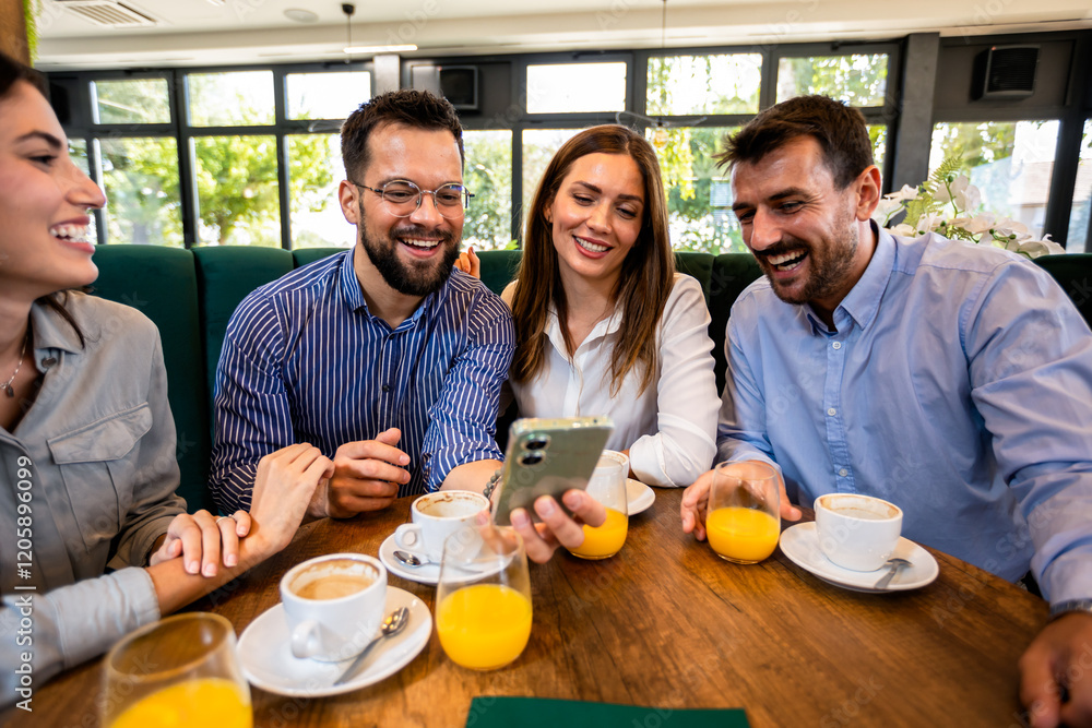Group of friend met at the cafe. Looking at pictures on the phone. Having fun time together. Group of friend met at the cafe. Looking at pictures on the phone. Having fun time together.
