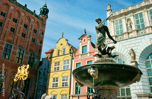 Gdansk Poland. The Neptune Fountain, erected 1633, in front of the ornate façades of the Main Town Hall and the Court of Artus photo