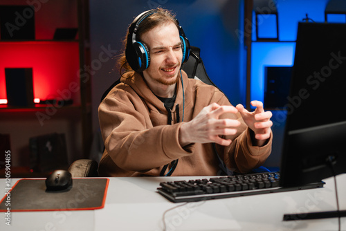 Φωτογραφία angry gamer streamer expressing frustration during live stream, wearing headphones and hoodie