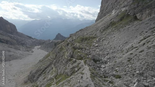 Aerial footage of Sentiero Alfredo Benini from Castelletto Superiore to Rifugio Tuckett e Sella in the Brenta Dolomites, featuring rugged limestone cliffs, exposed ridges, and scenic alpine landscapes photo