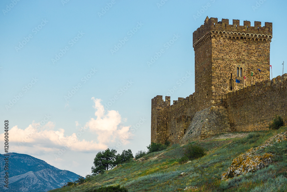 Beautiful view of the fortress wall with towers of the Genoese fortress in the city of Sudak. Crimean Peninsula. Russia Beautiful view of the fortress wall with towers of the Genoese fortress in the city of Sudak. Crimean Peninsula. Russia