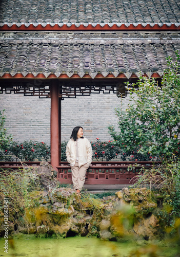 A Chinese woman visiting the South Garden of Tianyi Pavilion in Haishu District, Ningbo QDCity, Zhejiang Province, China, during December photo