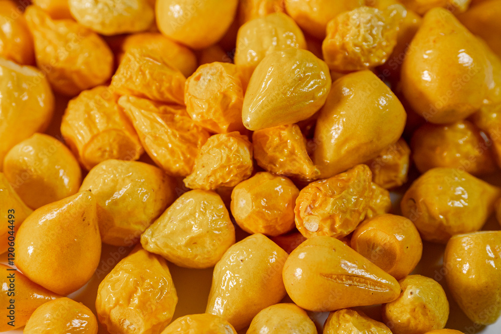 A detailed close-up of freeze-dried Argentine chili peppers, showcasing their vibrant yellow color, glossy texture, and seeds. Perfect for culinary or spice applications. A detailed close-up of freeze-dried Argentine chili peppers, showcasing their vibrant yellow color, glossy texture, and seeds. Perfect for culinary or spice applications.