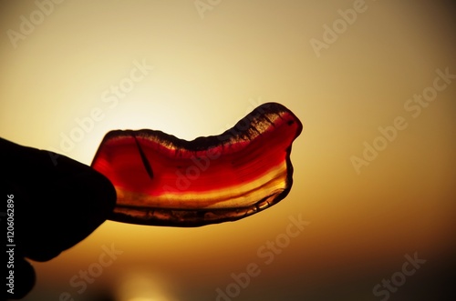 Mineral stone photographed against the sun at sunset