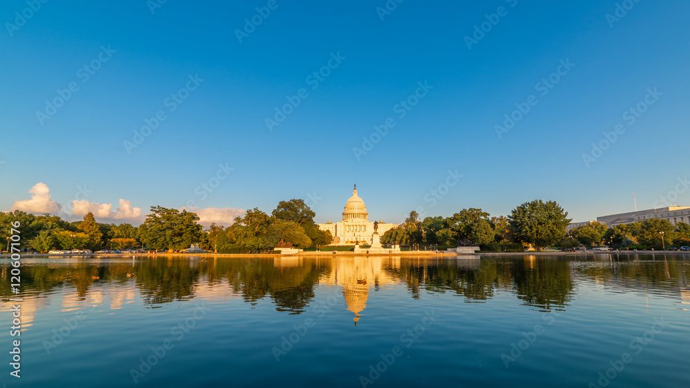 United States Capitol Building reflected on the pool on a clear evening United States Capitol Building reflected on the pool on a clear evening