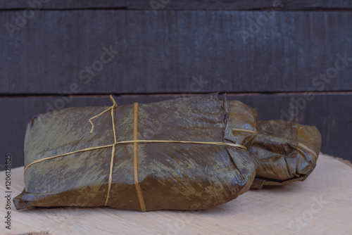 Colombian tamale recipe with steamed banana leaves photo