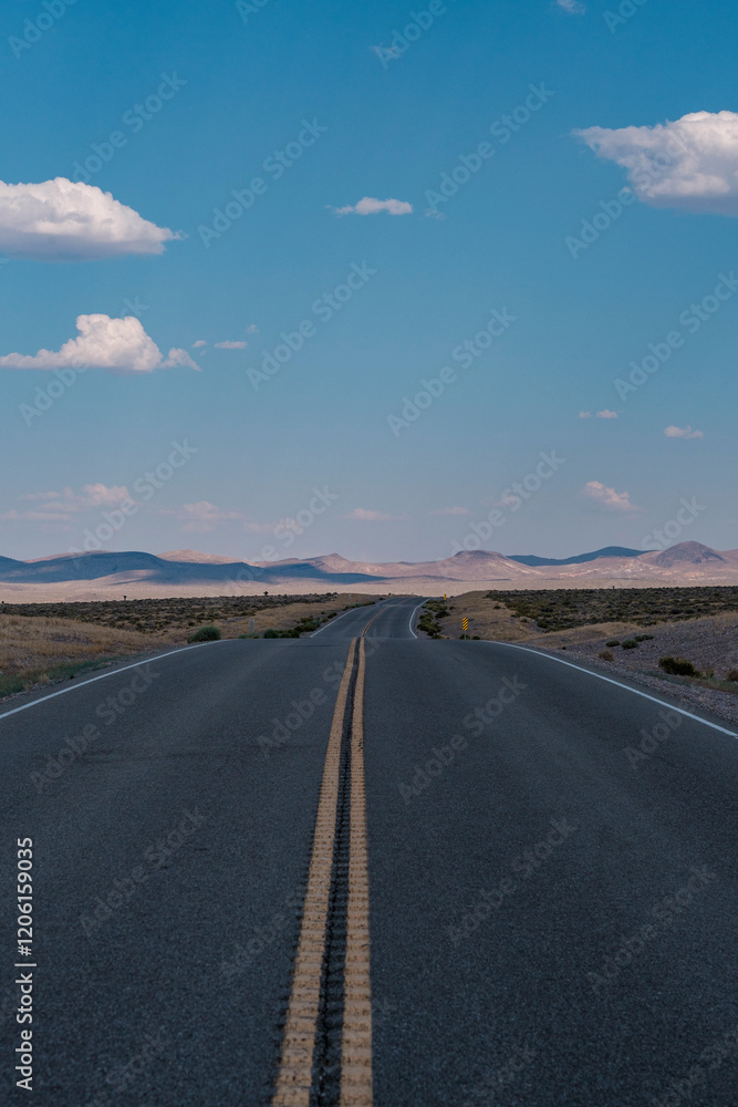 Summer clouds over the Highway in the Nevada desert, Nevada, USA Summer clouds over the Highway in the Nevada desert, Nevada, USA